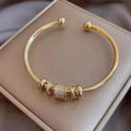Adjustable Bracelet With Golden Charms