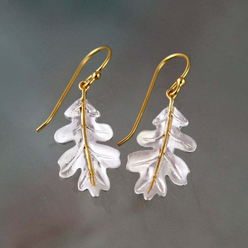 Earrings in Gold With White Leaves